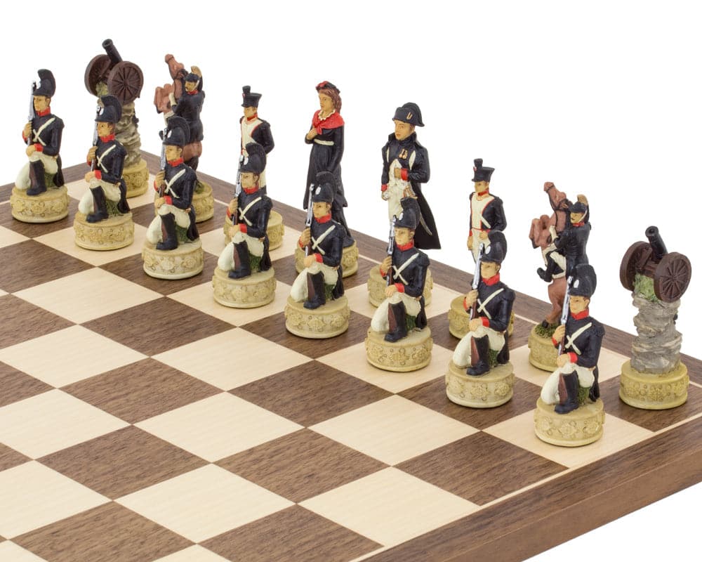 Hand-painted Napoleon vs Russians chess pieces on chessboard representing Napoleonic Wars soldiers and historical figures.