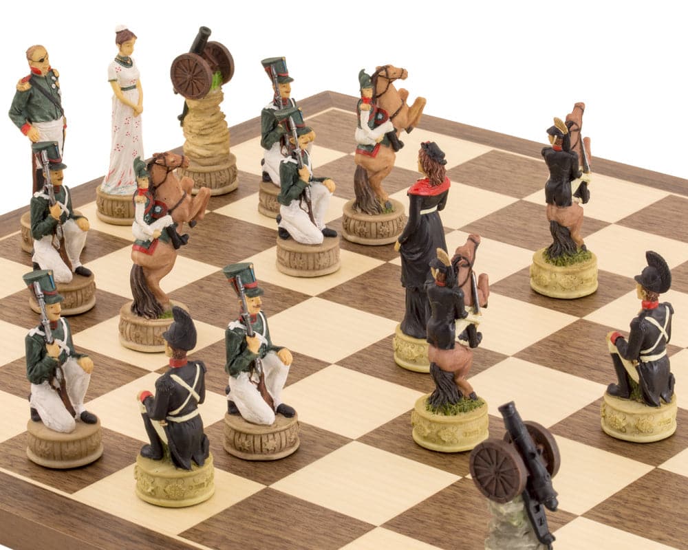 Hand-painted Napoleon vs Russians chess pieces on a wooden chess board, showcasing intricate historical figures and soldiers from the Napoleonic Wars.