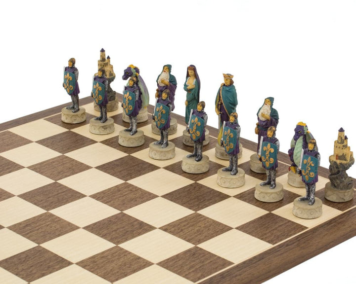 Medieval-themed hand-painted chess pieces in blue and purple by Italfama, set up on a chessboard.