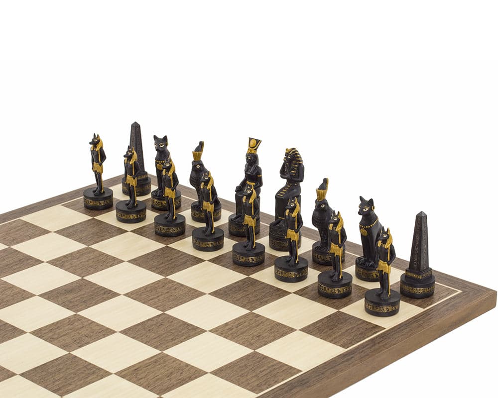 Ancient Egypt themed hand painted chess pieces on a chessboard by Italfama, intricately detailed in gold and black designs.