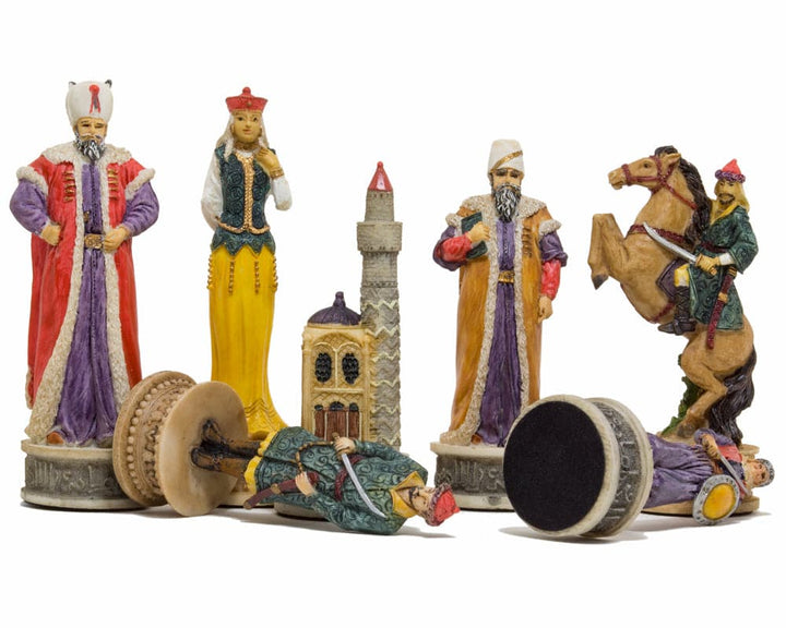 The Hungarians vs Turkish hand painted themed chess pieces by Italfama displaying intricate and colorful designs against a white background