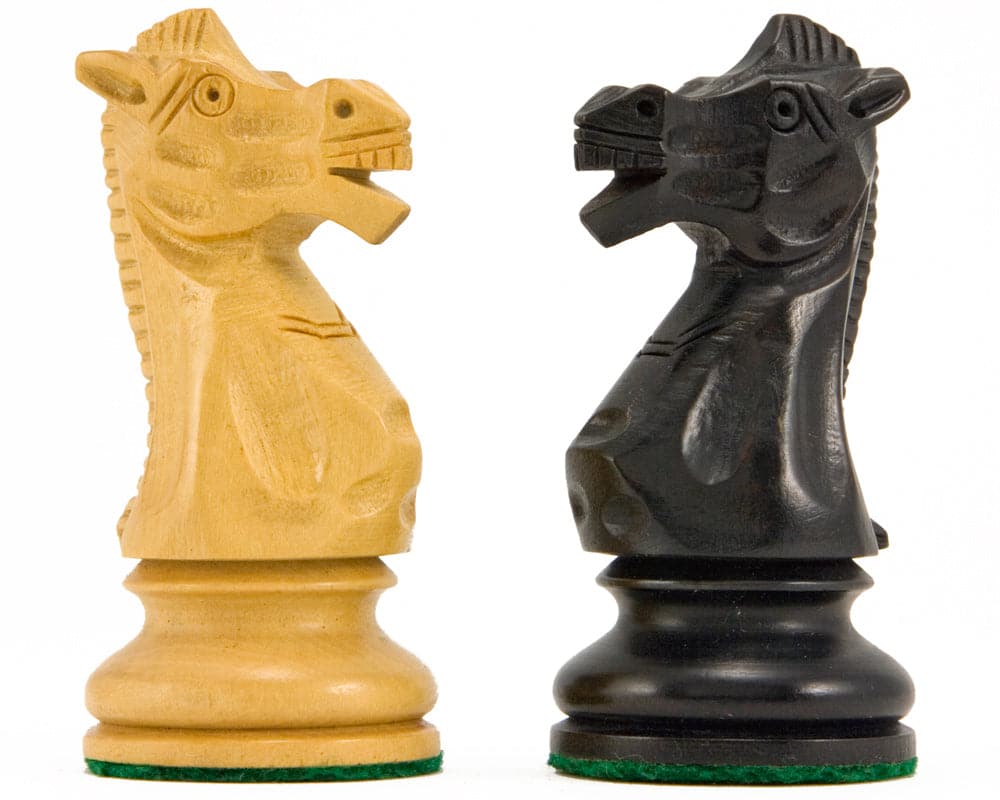 Ebonised and natural boxwood knight chess pieces from the Flower Series Staunton set.