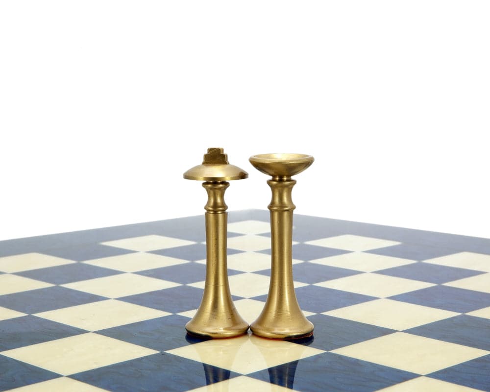 Metropolis Series brass and nickel chess pieces on chessboard, minimalist design, 2.75" king, hand turned by Italian craftsmen.