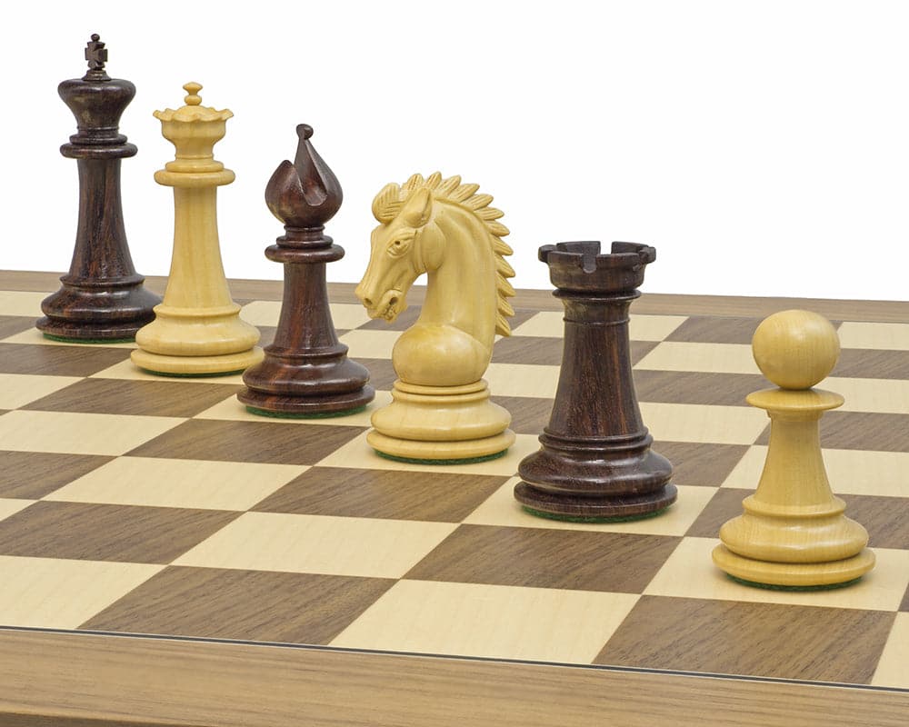 The Sheffield Knight Rosewood Chessmen 3.75 inch set on a chessboard, featuring intricately detailed and beautifully ornate pieces