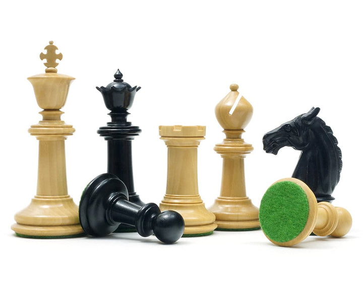 Traditional Staunton ebony and boxwood chess pieces, including a 3.75 inch king and felted bases, arranged on a white background.