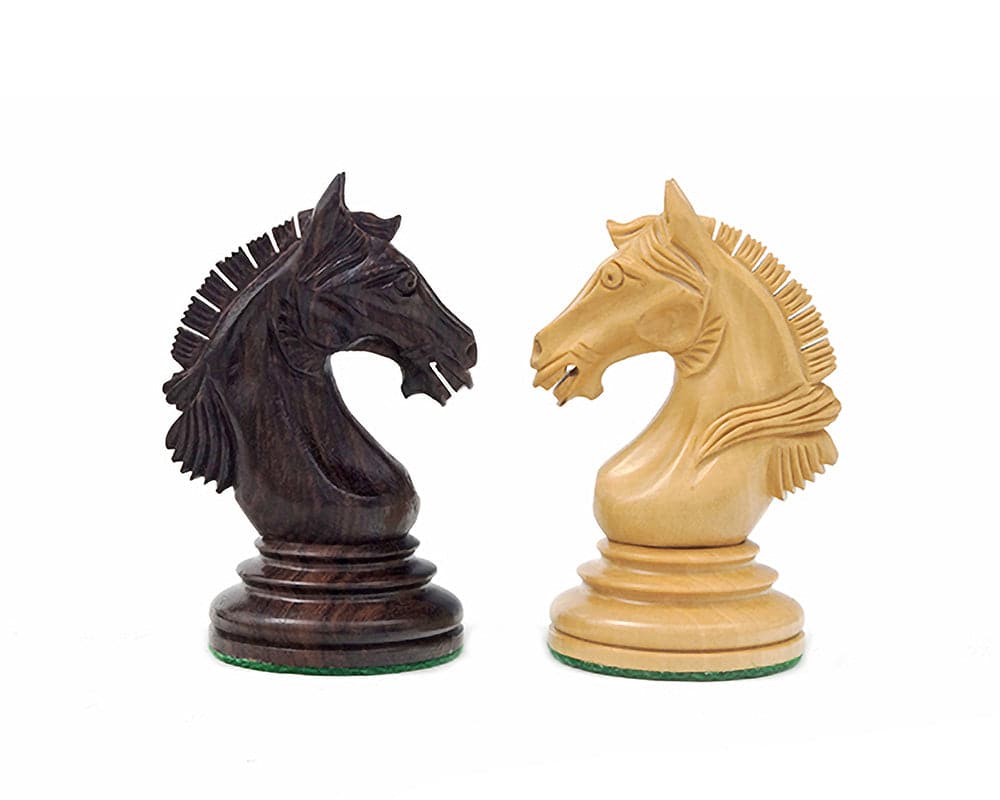 Rosewood and light wood knight chess pieces from The Garvi set with detailed carving, inspired by 16th century Indian history.