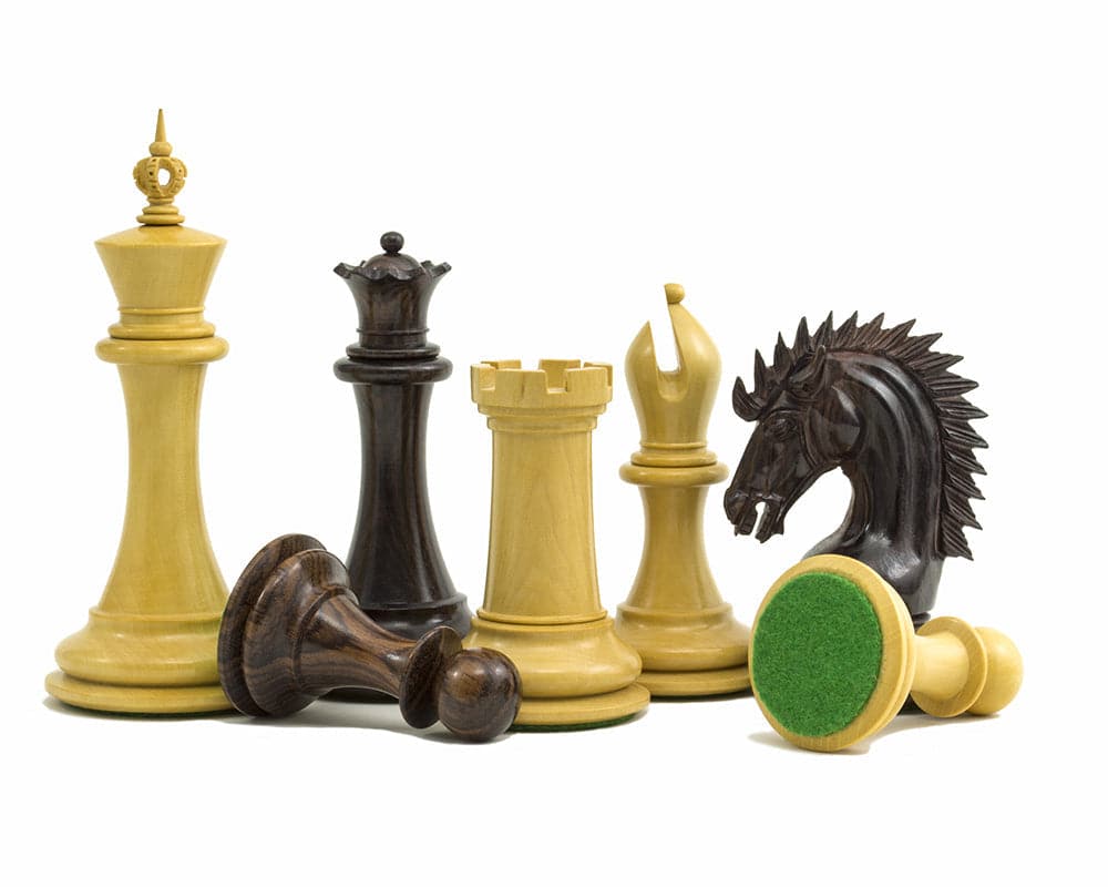 The Sheffield Knight Rosewood Chessmen 4.25 inch set featuring intricately handcrafted chess pieces with weighted bases and billiard cloth.