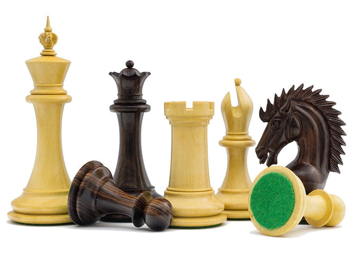 The Sheffield Knight Rosewood Chessmen 4.25 inch set with handcrafted weighted pieces, including a detailed knight and two additional queens.