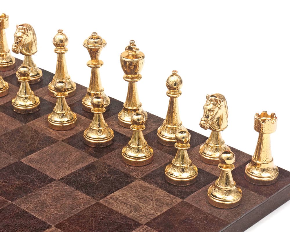 Gold and silver plated chessmen on chessboard, expertly crafted in Italy, with 3 inch king and detailed, weighted pieces.