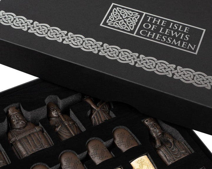 Official Isle of Lewis chess set featuring intricately crafted pieces in a luxurious gift box, perfect for collectors.