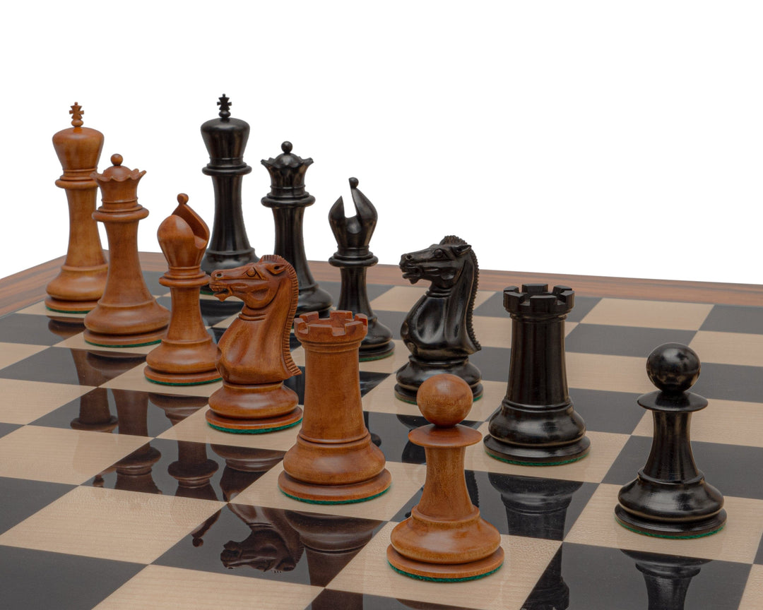 Reproduction Staunton Chessmen 1849 in antiqued boxwood and ebony on a chessboard featuring 4.4 inch king pieces.