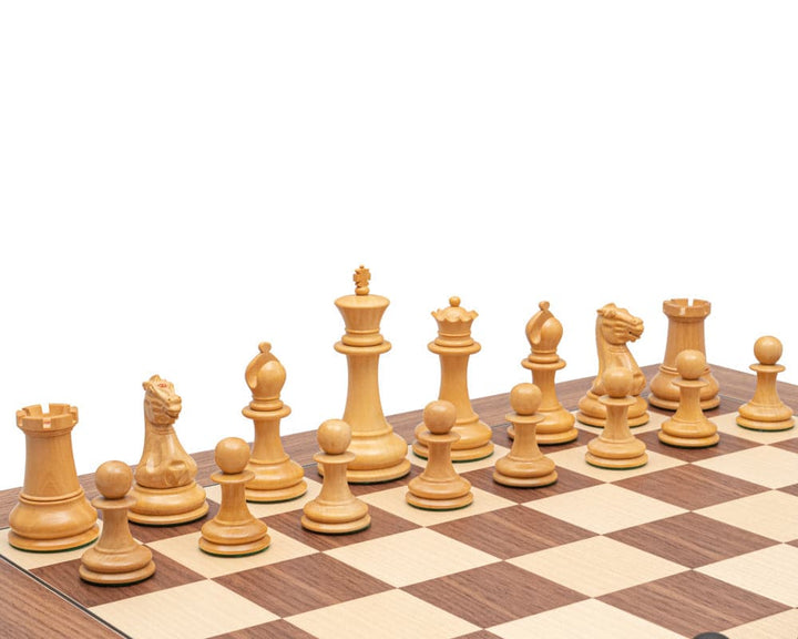 Luxurious Staunton chess pieces crafted from boxwood displayed on a wooden chessboard.