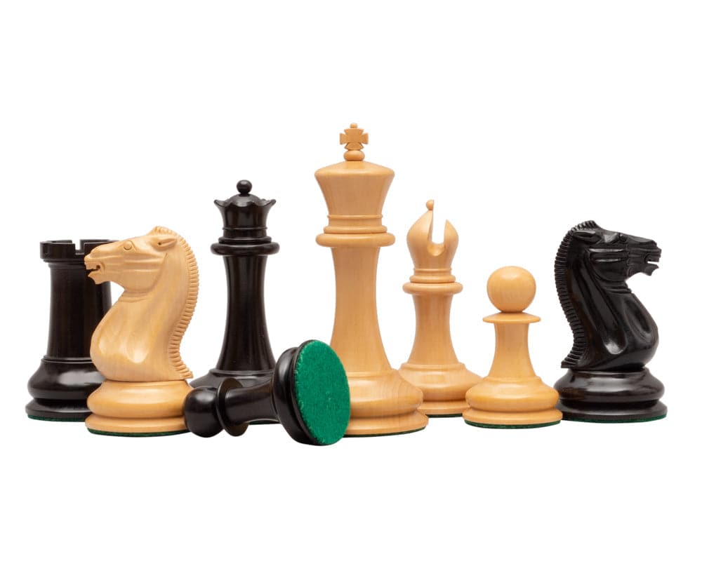 J J Cooke Reproduction Chess Men in Ebony 4.4 inch with 2 inch bases, featuring detailed Staunton design pieces including kings, bishops, knights, and rooks.