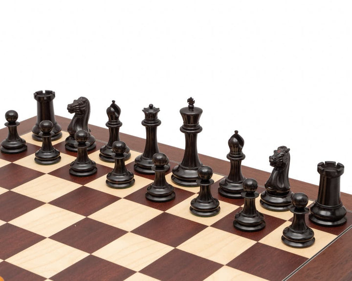 J J Cooke Edition Ebony and Antiqued Boxwood Chessmen 4.4 inches on a chessboard.