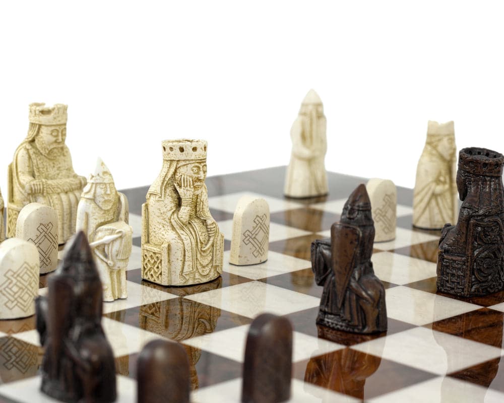 Isle Of Lewis Italian Briarwood chess set showcasing detailed, museum-quality chess pieces on an elegant chessboard.