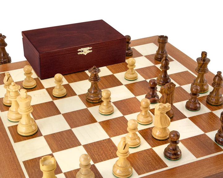 French Knight Sheesham Mahogany Chess Set with hand-carved weighted chessmen, displayed on a mahogany and maple board, with a wooden box.