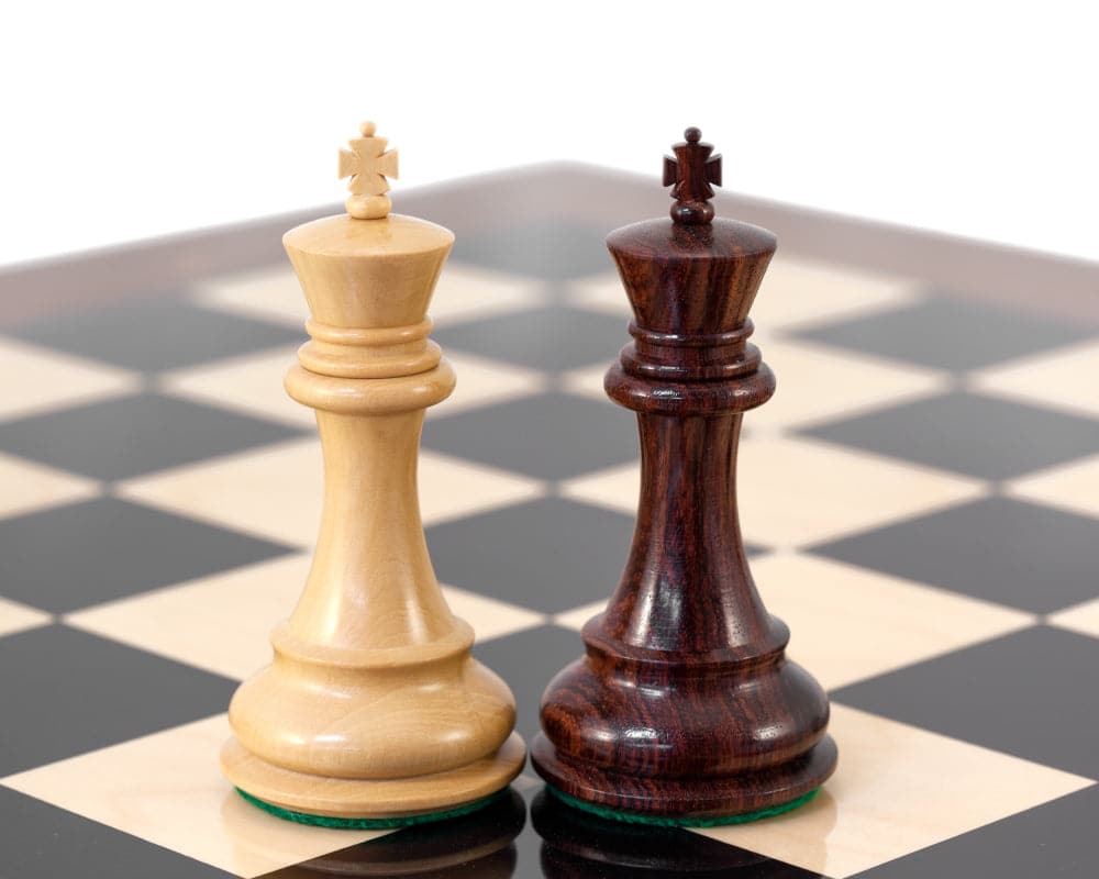 Close-up of rosewood and light wood kings on Sandringham Grand Rosewood Chess Setâ€™s high gloss board