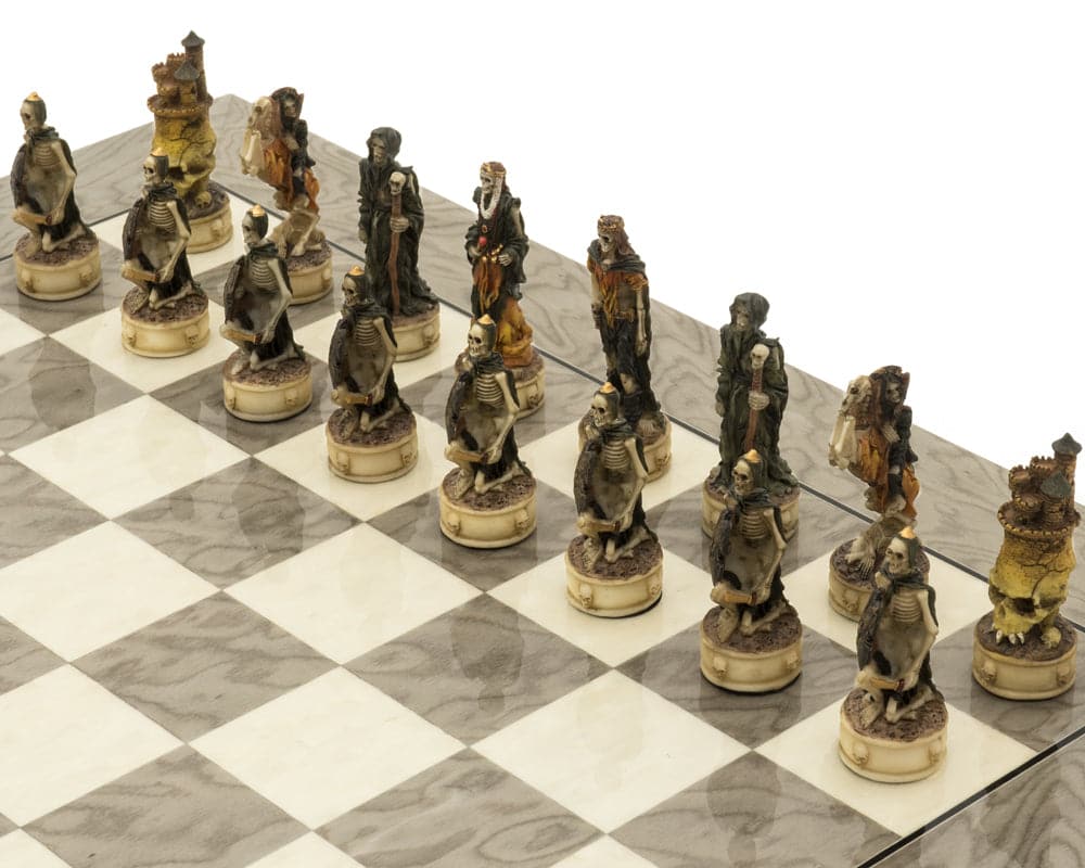 Zombie and skeletal warrior chess pieces on glossy grey ash burl board in deluxe fantasy-themed chess set.