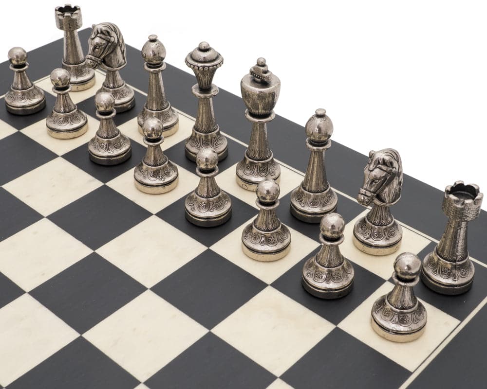 The Finnesburg and Black Classic Chess Set with brass and nickel chessmen arranged on erable chessboard.