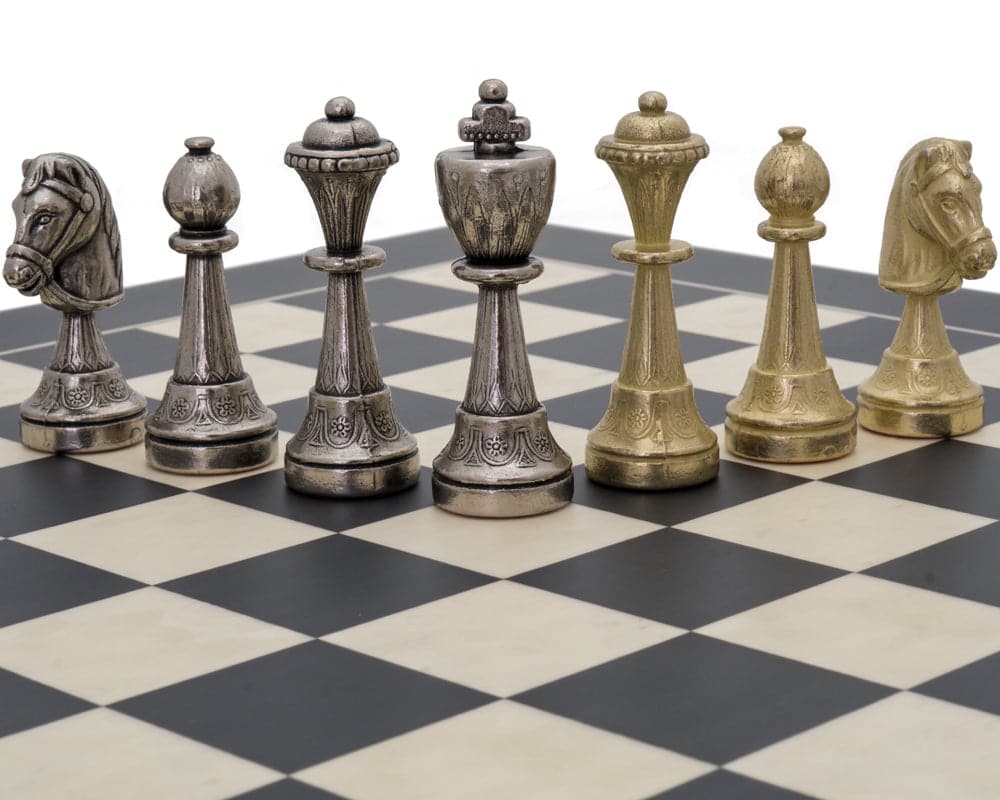 The Finnesburg and Black Classic Chess Set with brass and nickel chessmen on checkered chessboard