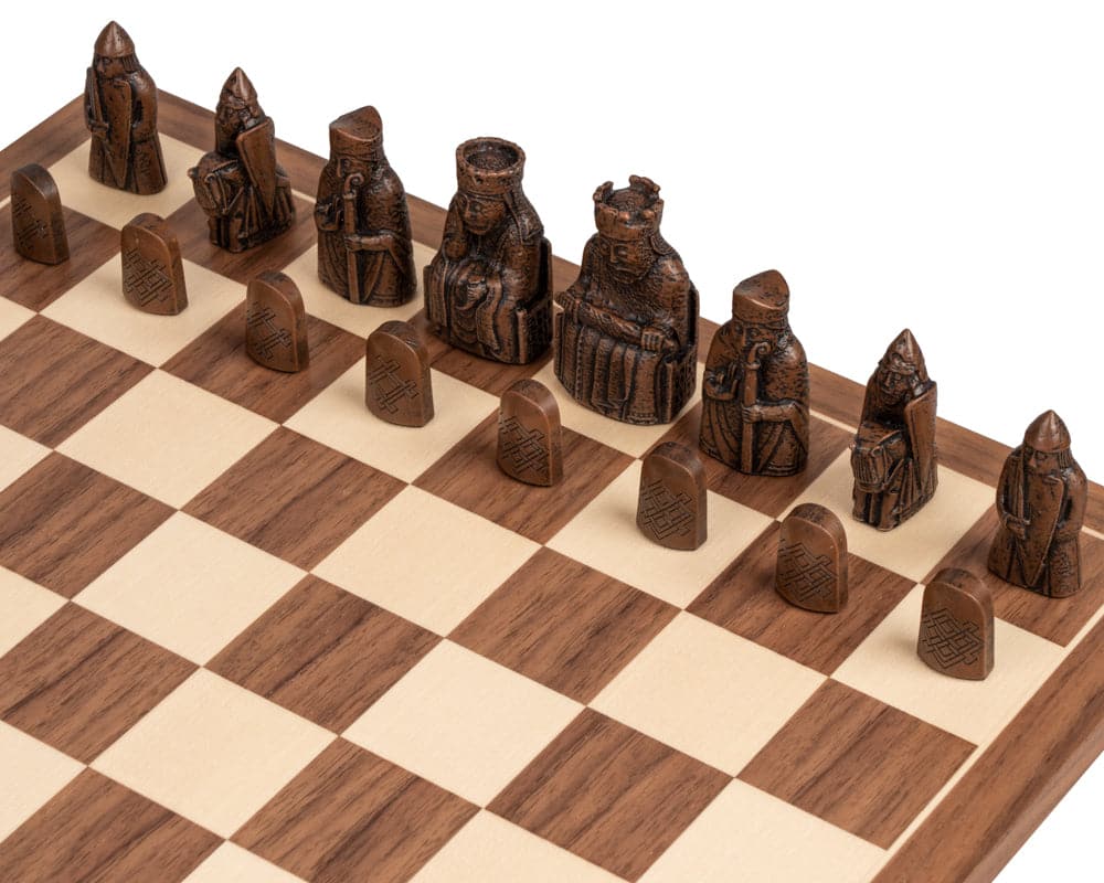 Isle of Lewis and Walnut Deluxe Chess Set with intricate chess pieces on a walnut board