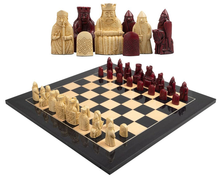 Isle of Lewis black and red chess set with cream and red chessmen on a black board.