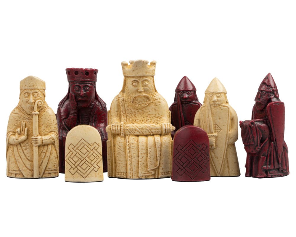 Isle of Lewis black and red chessmen set, showcasing king, queen, and other pieces in intricate red and cream hues