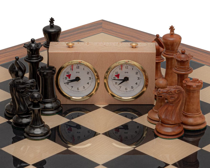 The 1849 Reproduction Staunton Ebony and Antiqued Chess Set with Clock on Spanish Board