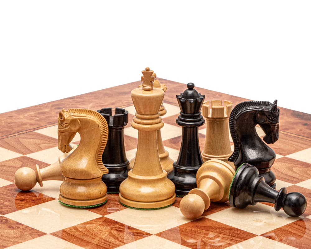 The Leningrad Black and Elm Burl Luxury Chess Set on Italian board with weighted ebonised boxwood pieces and additional queens