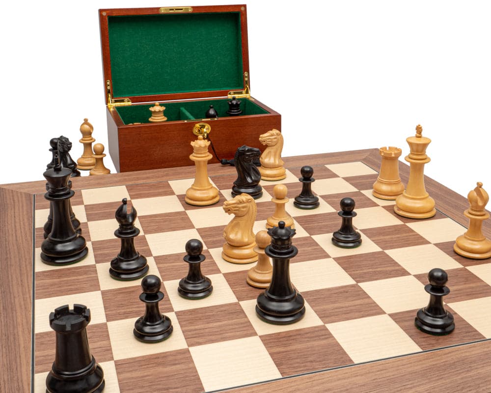 Luxury Staunton chess set with ebony and walnut pieces on a 23.6-inch board, mahogany cabinet with green flock lining, and chess clock.