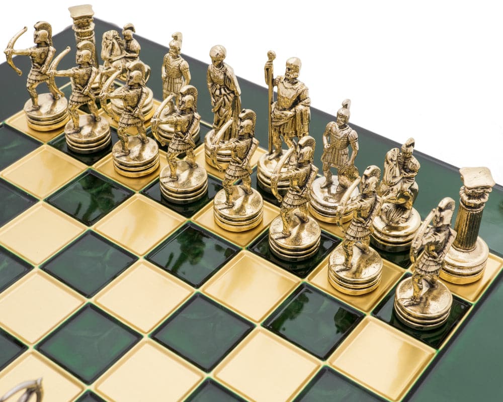 The Manopoulos Archers Chess Set displaying detailed golden chess pieces on a black and gold chessboard.