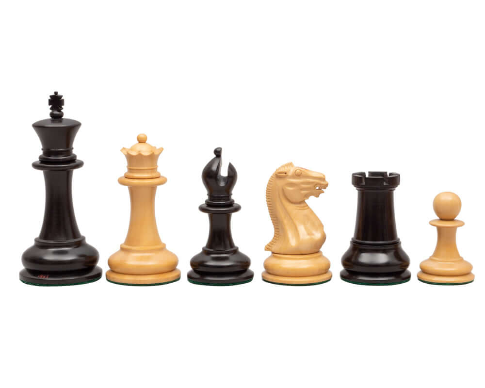 1851 Reproduction Staunton Ebony Chessmen 4.4 inch, including king, queen, bishop, knight, rook, and pawn in ebony and boxwood.